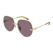 Solbriller med luksuriøst guldfarvet stel og violet linser