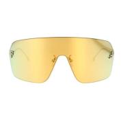 Moderne skjold solbriller med guld metal arme og spejlet guld linse