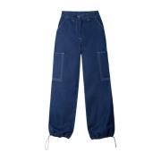 Løstsiddende blå bukser med kontrast hvide lommesyninger
