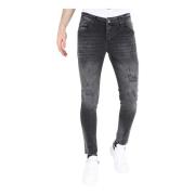 Revne biker jeans med splatter i slim fit til mænd