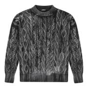 Håndsprøjtet kabelstrikket sweater