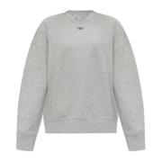 Sweatshirt med logoformet applikation