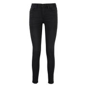 Højtaljede skinny jeans med metal knapper