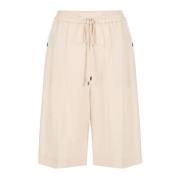 Pudderfarvede komfortable Bermuda shorts i flydende Tencel-stof