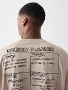 Bershka Bluser & t-shirts 'WEEKLY CALENDAR'  beige / sort